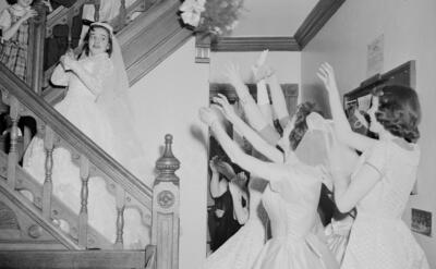 grayscale photo of bride and groom dancing