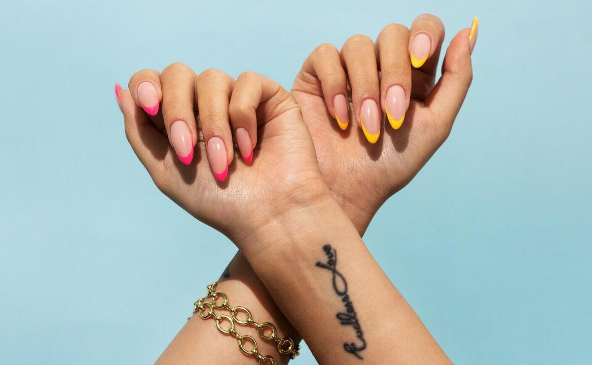 Woman showing her nail art on fingernails