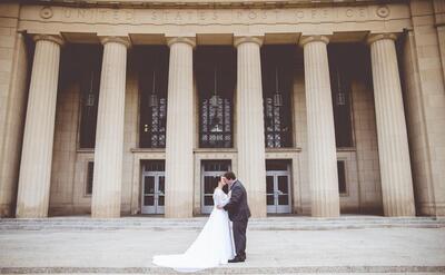 Man kissing woman on their wedding day