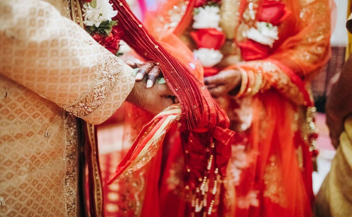 Ritual with coconut leaves during traditional Hindu wedding ceremony