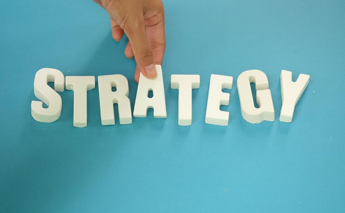 arrange white letters STRATEGY