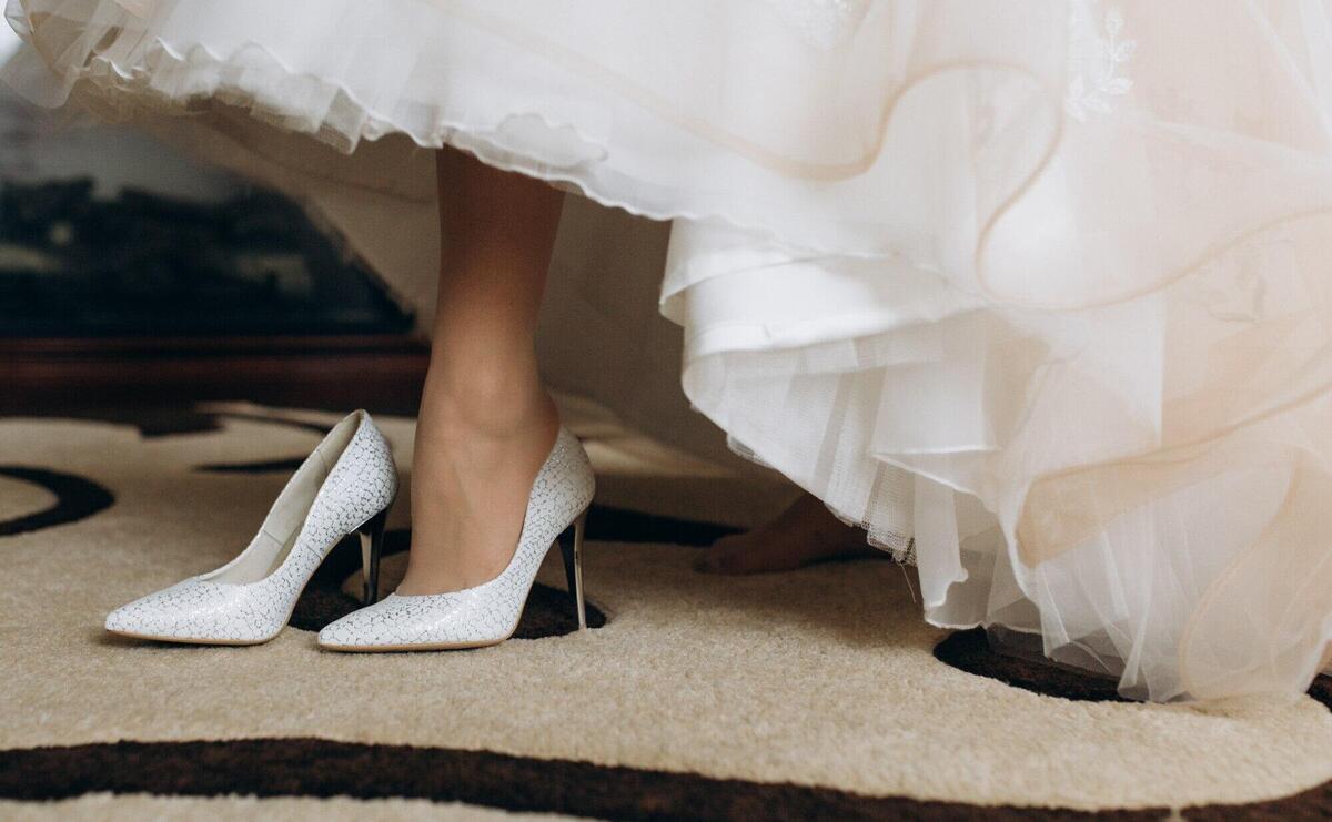 Bride is wearing her bridal heels