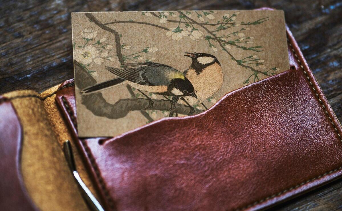 Business card with birds in a wallet