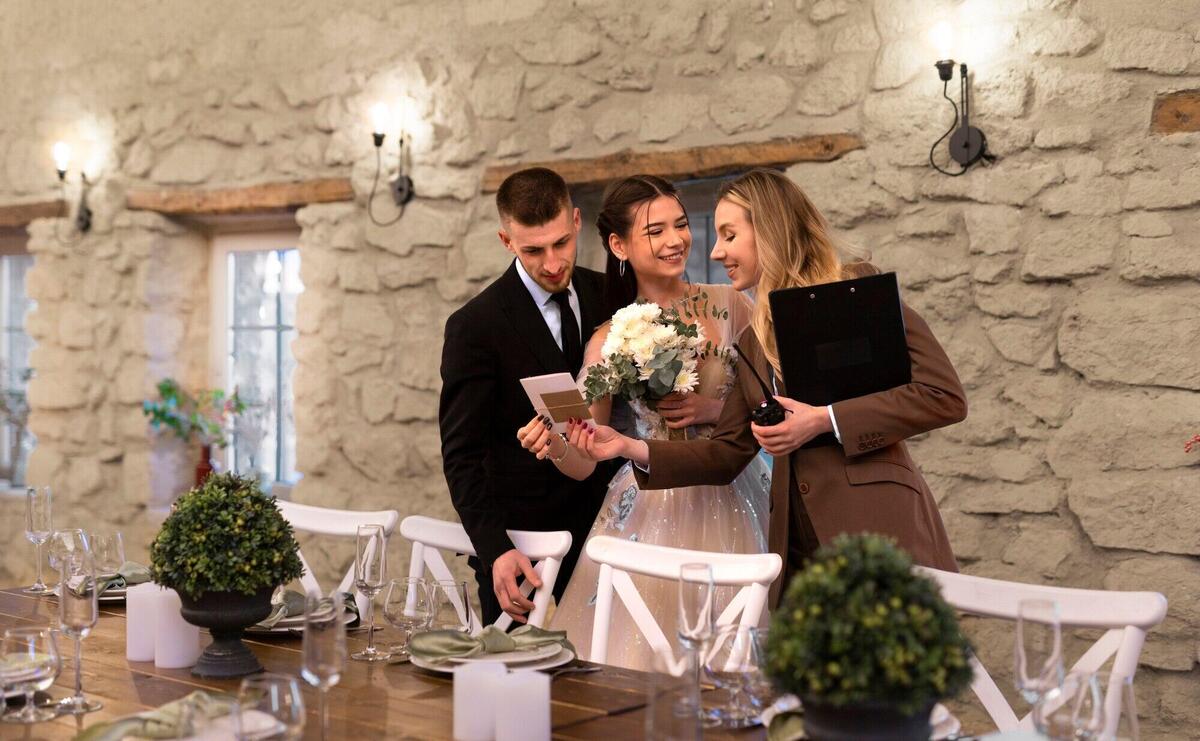 Female wedding planner working with bride and groom