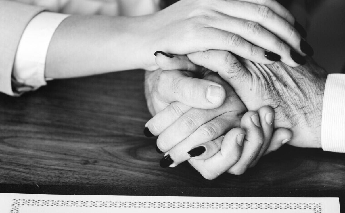 Married elderly couple with marriage certificate